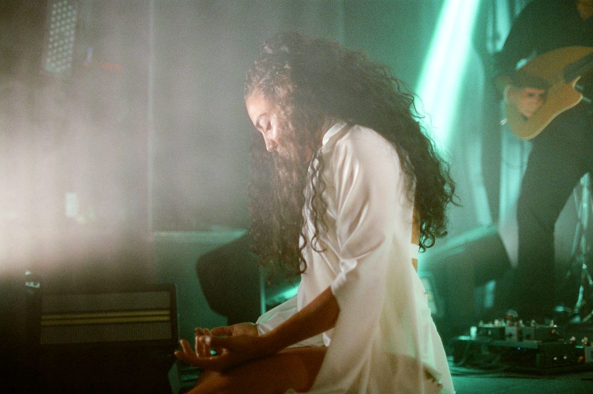 Performer at the keys in green haze